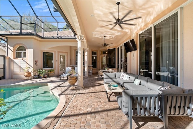 view of patio / terrace featuring glass enclosure and an outdoor hangout area