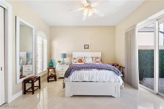 bedroom with access to exterior, ceiling fan, and light tile patterned flooring