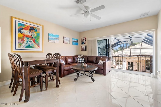 tiled living room featuring ceiling fan