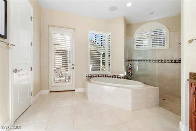 bathroom with vanity, separate shower and tub, and tile patterned flooring