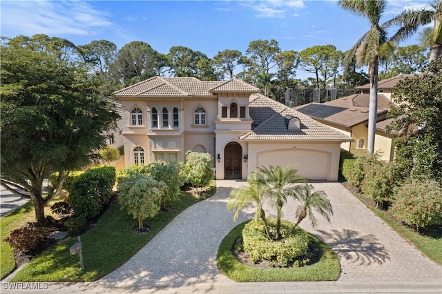 mediterranean / spanish-style house featuring a garage