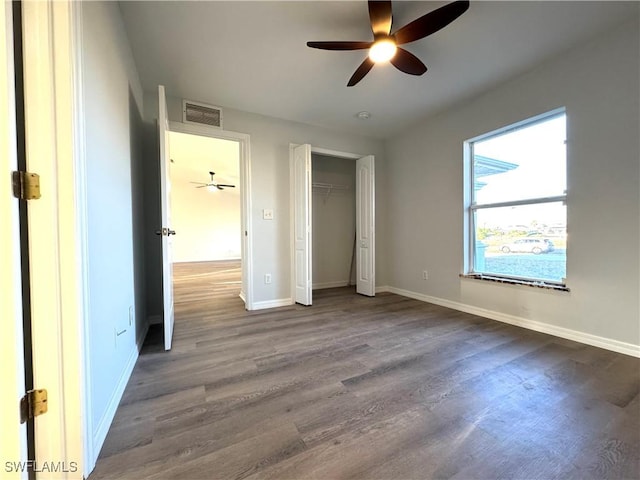 unfurnished bedroom with wood-type flooring and ceiling fan