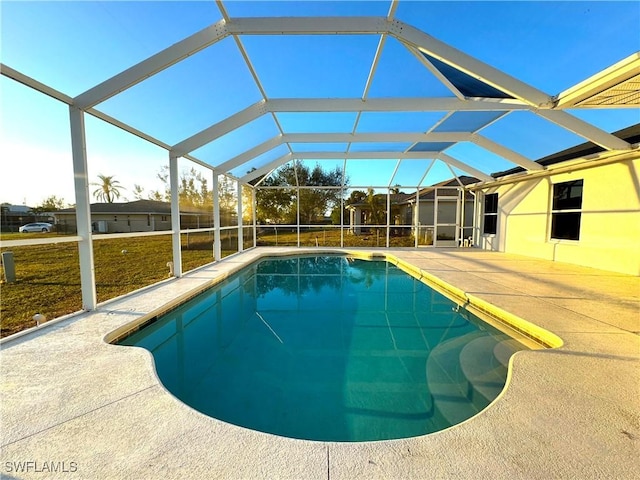 view of pool with a patio and a lanai