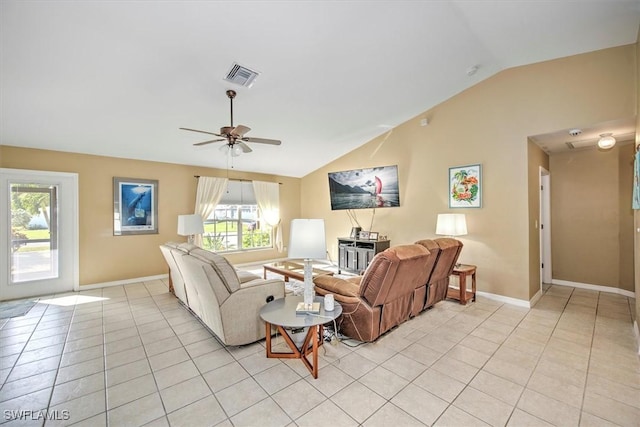 living room with ceiling fan, light tile patterned floors, and lofted ceiling