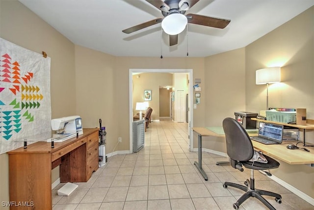 home office with ceiling fan and light tile patterned flooring