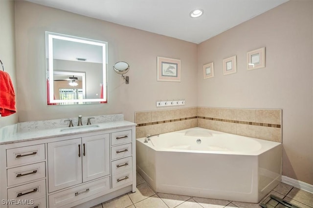 bathroom featuring ceiling fan, tile patterned flooring, vanity, and a bath