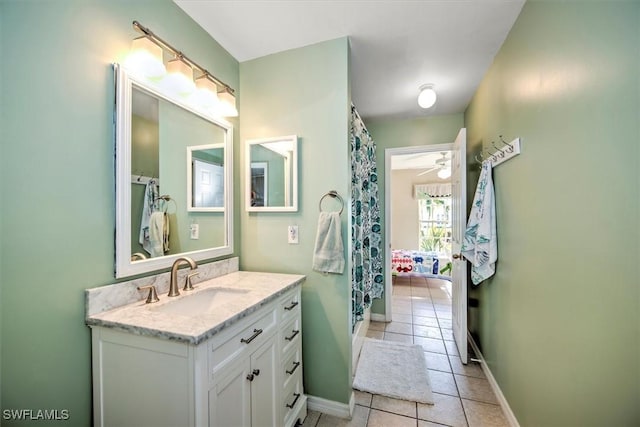 bathroom featuring tile patterned floors, ceiling fan, and vanity