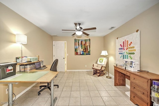 tiled office featuring ceiling fan