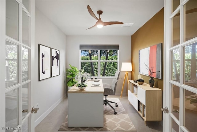 office space featuring french doors, light tile patterned floors, and ceiling fan