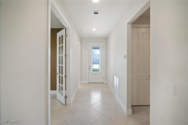 interior space with light tile patterned floors