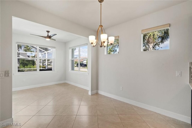 unfurnished room featuring light tile patterned floors and ceiling fan with notable chandelier