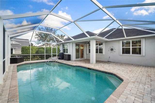 view of pool featuring a patio area and a lanai