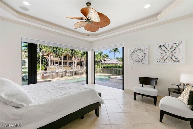 bedroom with access to exterior, ceiling fan, a raised ceiling, light tile patterned floors, and ornamental molding