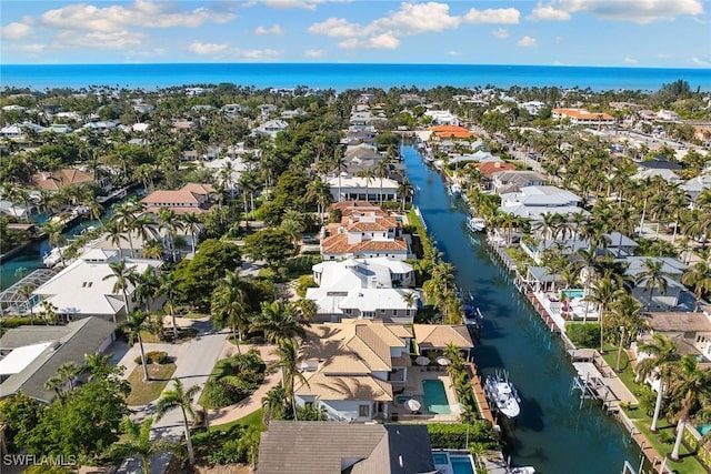 birds eye view of property featuring a water view