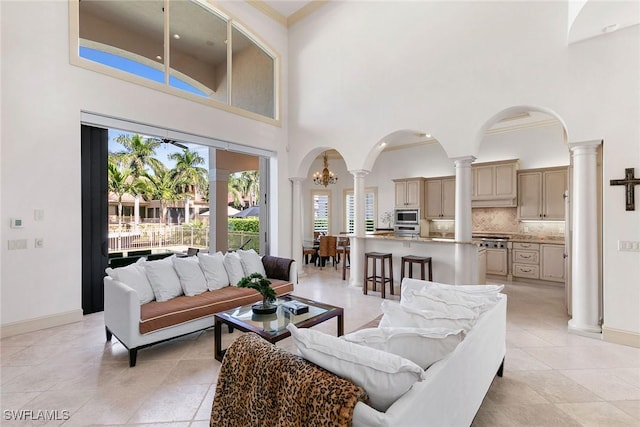 living room featuring a towering ceiling