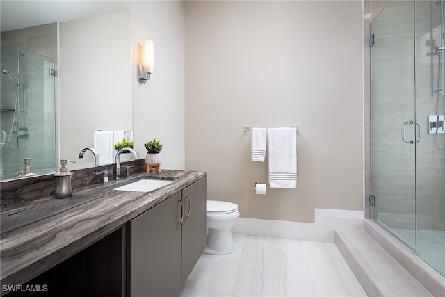 bathroom featuring tile patterned flooring, vanity, toilet, and an enclosed shower