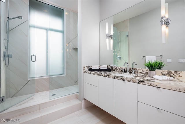 bathroom with vanity and an enclosed shower