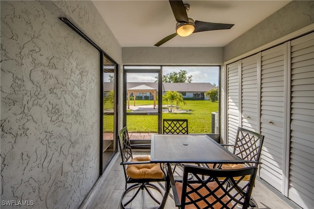 sunroom / solarium with ceiling fan