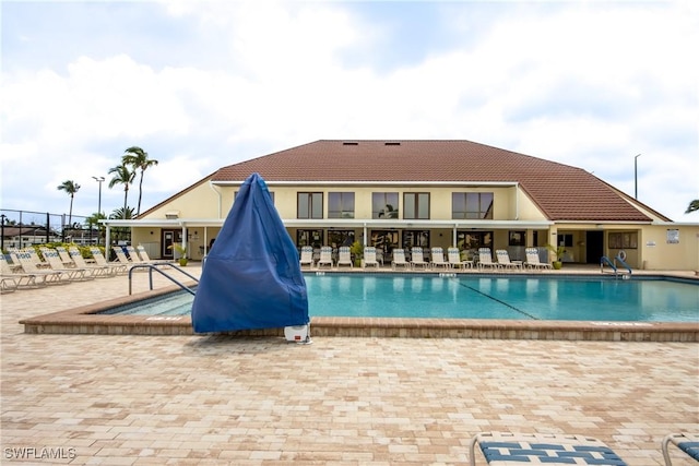 view of pool featuring a patio