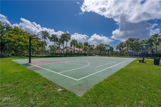 view of basketball court with a playground and a yard