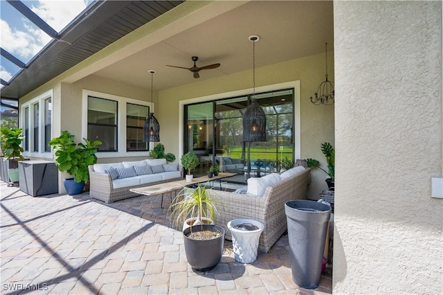 view of patio with outdoor lounge area and ceiling fan