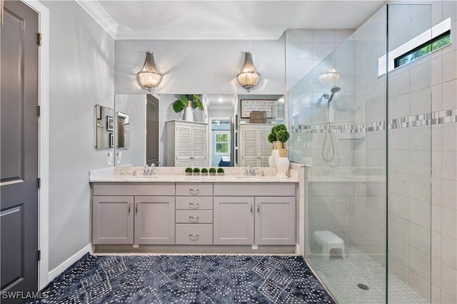 bathroom featuring crown molding, tiled shower, and vanity