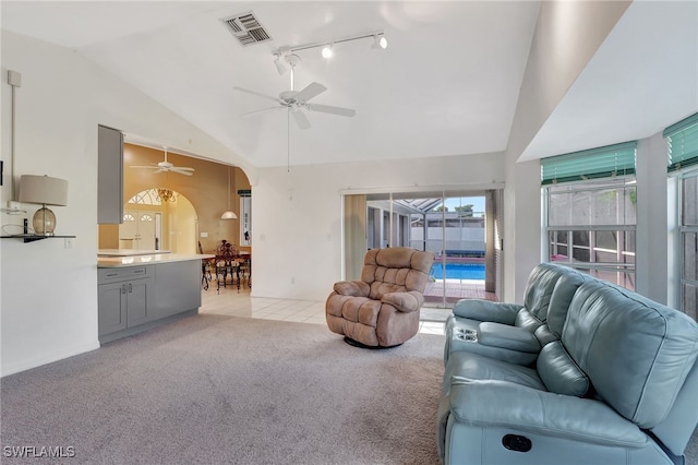 carpeted living room with lofted ceiling