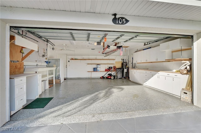 garage with a garage door opener and water heater