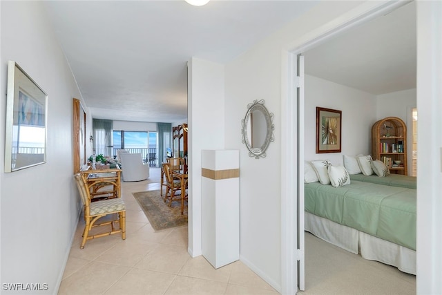 hallway with light tile patterned floors