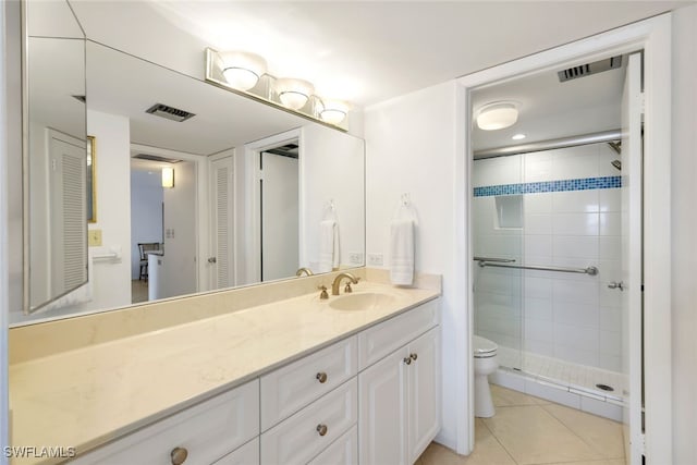 bathroom featuring walk in shower, tile patterned floors, vanity, and toilet