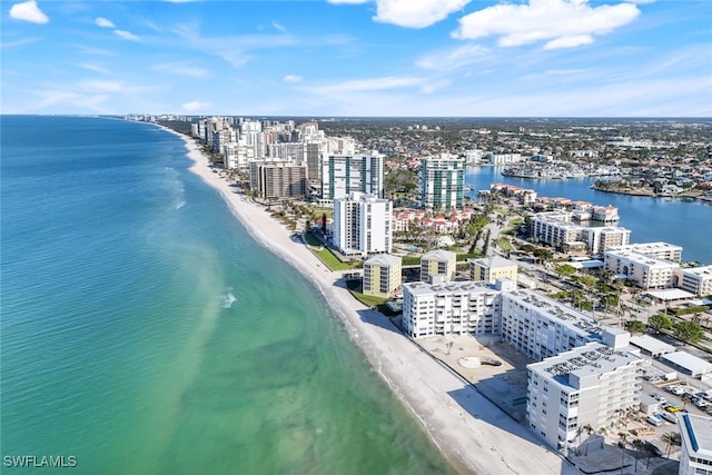 aerial view featuring a view of the beach and a water view