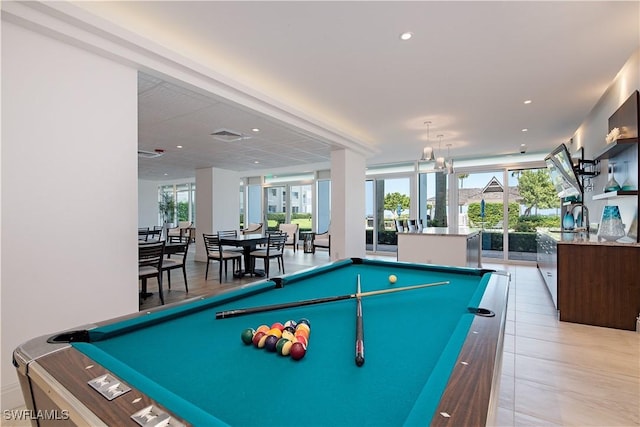 rec room with a wealth of natural light, floor to ceiling windows, sink, and pool table