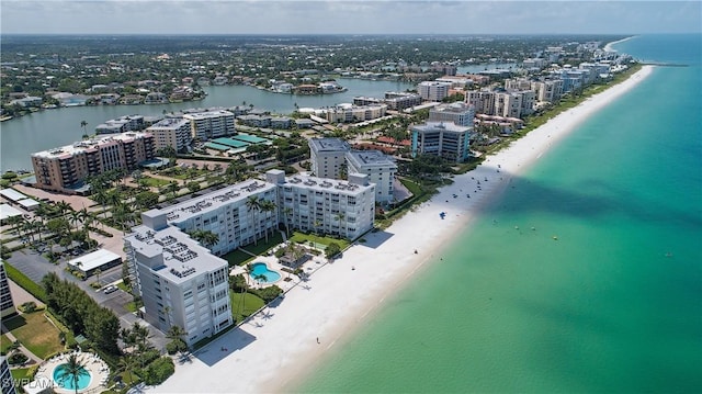 birds eye view of property with a view of the beach and a water view