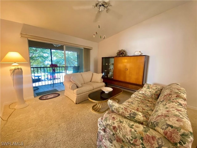 living room with vaulted ceiling and carpet