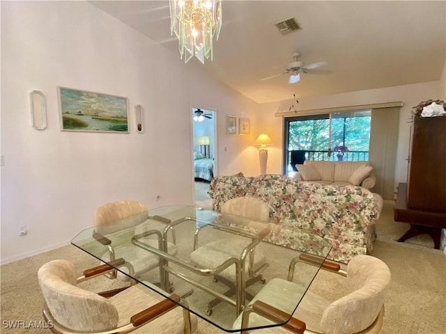 interior space with vaulted ceiling and ceiling fan with notable chandelier