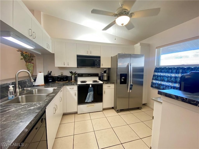 kitchen featuring lofted ceiling, sink, black appliances, light tile patterned floors, and white cabinets