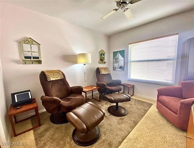 sitting room featuring carpet floors and ceiling fan