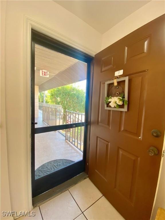 doorway featuring light tile patterned floors