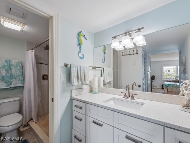 bathroom featuring a shower with curtain, vanity, and toilet