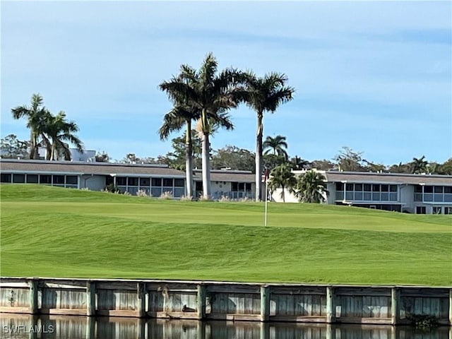 view of home's community with a yard