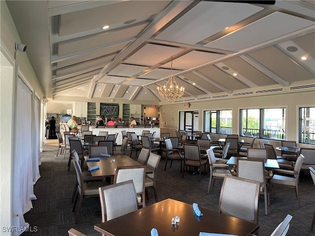 carpeted dining area featuring lofted ceiling and a notable chandelier