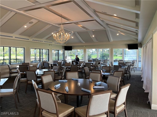 dining room with a chandelier and lofted ceiling with beams