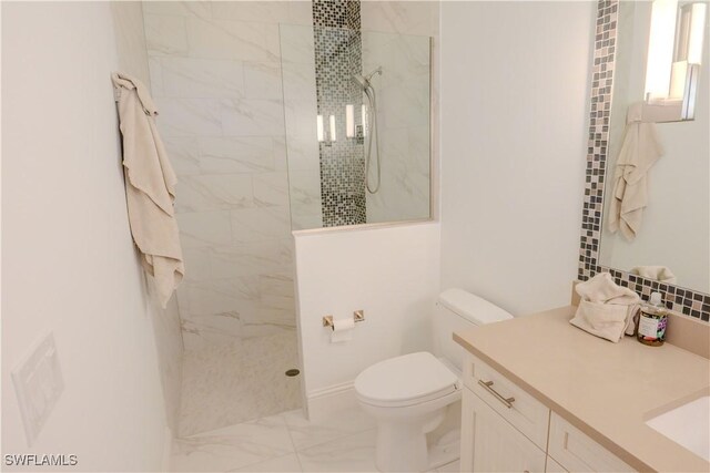 full bathroom featuring toilet, marble finish floor, a walk in shower, and vanity