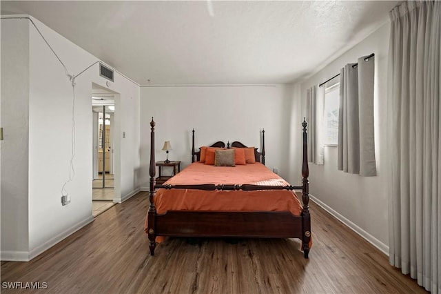 bedroom featuring hardwood / wood-style floors