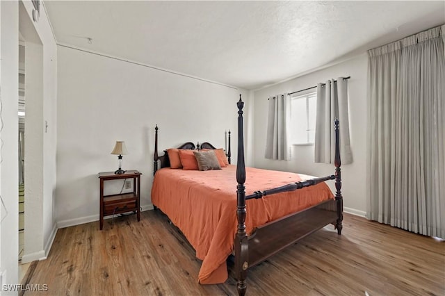 bedroom featuring wood-type flooring