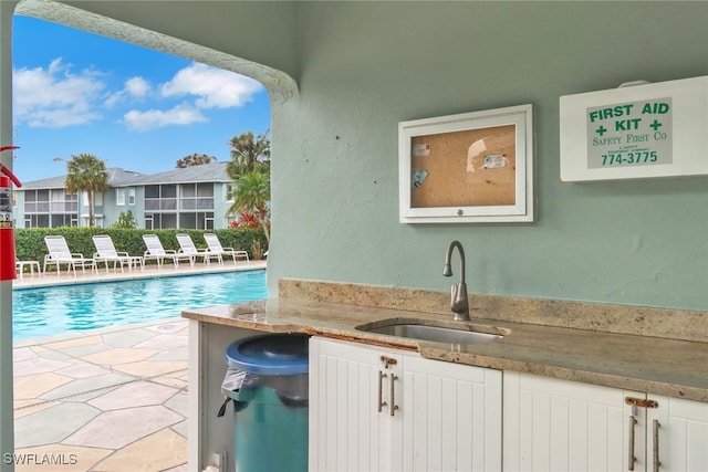 view of pool featuring sink