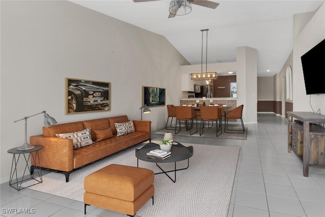 tiled living room with vaulted ceiling and ceiling fan