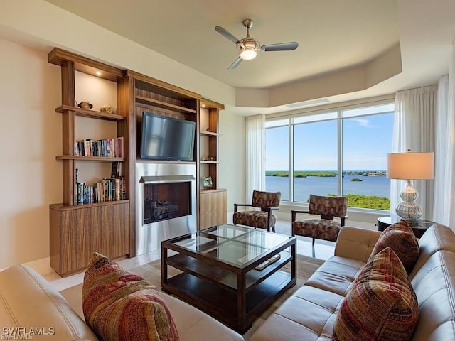 living room featuring a wealth of natural light and ceiling fan