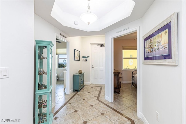 corridor featuring light tile patterned flooring