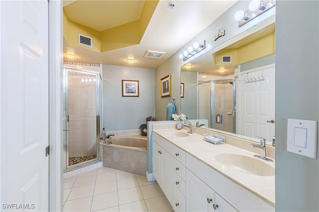 bathroom featuring tile patterned floors, vanity, and plus walk in shower